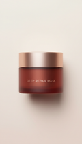 Deep Repair Mask jar, Hero angle: 3/4 product shots at eye-level with shallow DOF on textured neutral surfaces (stone,...